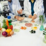 Microbiologist Working on Molecule Samples in Modern Food Science Laboratory, Control experts inspect the concentration of chemical residues. hazards, standard, contaminate.